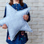 Coussin étoile demi-cercles blancs sur bleu pastel
