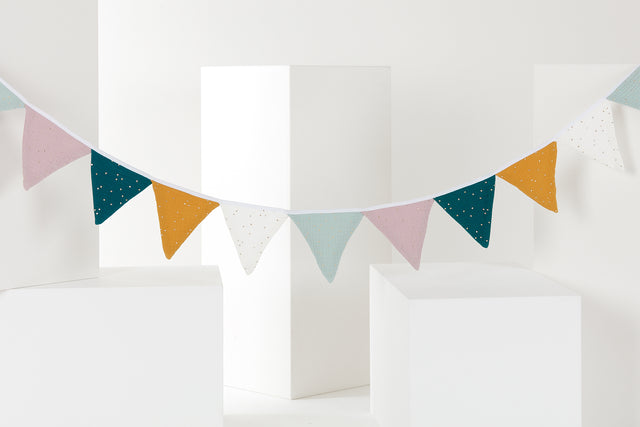 Bunting of gold dots on muslin