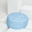 Pouf triangles arrondis blanc sur bleu