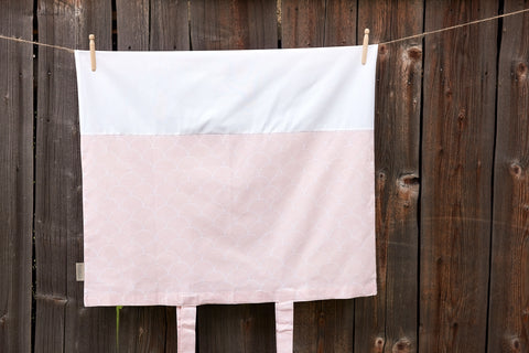 Cover for changing table mat white semicircles on pastel pink