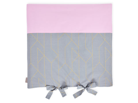 Cover for changing table mat with golden lines on gray