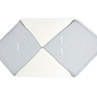 Eine weiche, faltbare Wickelunterlage mit hellgrauem, gemustertem Stoff und weißem Innenfutter - ideal in Kombination mit der KraftKids Decke für Babyschale Winter Musselin grau Pusteblumen für zusätzlichen Komfort.