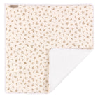 Die KraftKids Wickelunterlage Musselin Zweige braun hat einen cremefarbenen Bezug mit braunem Blattmuster und ein weiches weißes Innenfutter - ideal als kuschelige, wasserundurchlässige Unterlage oder Wickelunterlage für Ihr Baby.